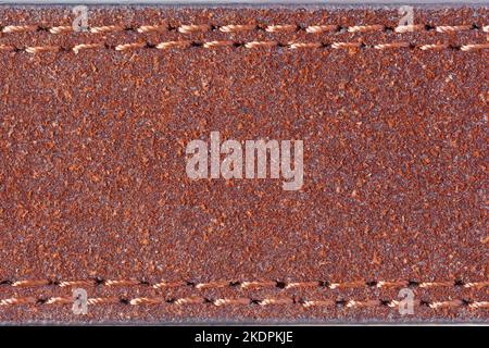 Brown faux leather with double stitching. Macro photography. Stock Photo
