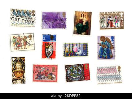 Vintage Christmas stamps from the United Kingdom on a white background. Stock Photo