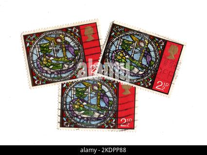 Vintage Christmas stamps from the United Kingdom on a white background. Stock Photo