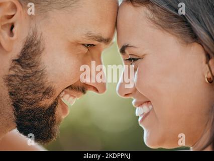 Face of happy couple touching head in love, care and happiness in garden, park or spring nature outdoors. Closeup young, smile and happy people, man Stock Photo