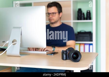 Photographer in his office working on the computer Stock Photo