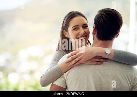 I found my love at first sight. Portrait of a happy young couple in a loving embrace. Stock Photo