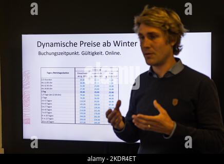 Todtnau, Germany. 08th Nov, 2022. Julian Probst, Managing Director of Feldbergbahnen, speaks while a table with prices for the coming winter season can be seen in the background. The dynamic pricing model of the lift association also provides for price increases for tickets purchased at short notice, but the operator did not name an upper limit when asked. The Feldberg lift association is presenting its plans for the 2022/23 winter season during a press conference today. Credit: Philipp von Ditfurth/dpa/Alamy Live News Stock Photo