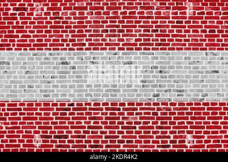 Close-up on a brick wall with the flag of Austria painted on it. Stock Photo