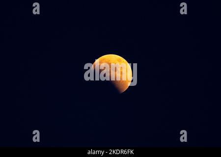 LIANYUNGANG, CHINA - NOVEMBER 8, 2022 - A total lunar eclipse is seen over Lianyungang City, Jiangsu province, China, November 8, 2022. Stock Photo