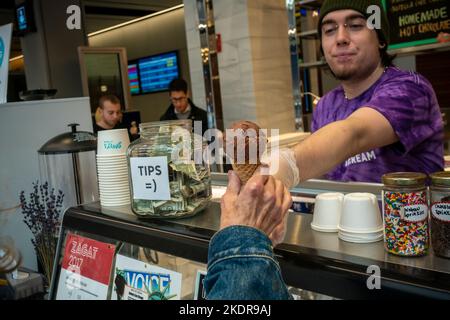 Free cones are the attraction at the grand opening of a branch of the Davey’s Ice Cream chain in the Moynihan Train Hall at Penn Station in New York on Friday, October 28, 2022. This is the third location for the local chain having stores in the East Village and in Greenpoint Brooklyn.(© Richard B. Levine) Stock Photo