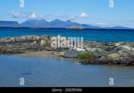 The Isle of Rum viewed from the beach at Arisaig, Argyll Scotland Stock Photo