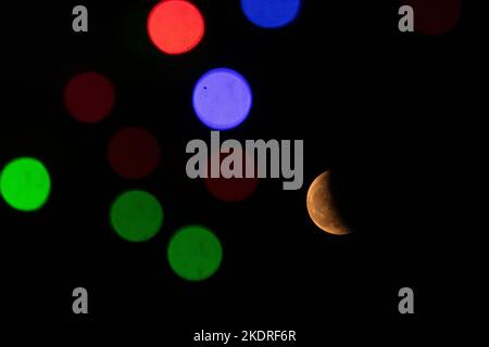 Kathmandu, NE, Nepal. 8th Nov, 2022. The half-eclipsed moon as seen from Chobar in Kathmandu, Nepal during its peak on November 8, 2022. (Credit Image: © Aryan Dhimal/ZUMA Press Wire) Stock Photo