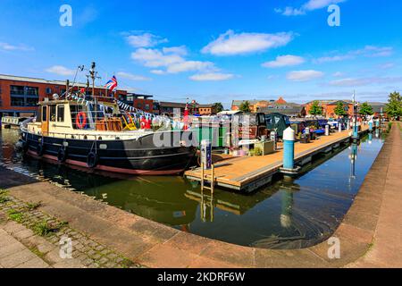 A colourful collection of narrow boats and others in the Diglis Basin on the Worcester & Birmingham Canal, Worcestershire, England, UK Stock Photo