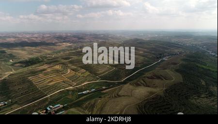 Ningxia haiyuan: colorful terraces, such as stairs, green mountain around the mountains Stock Photo