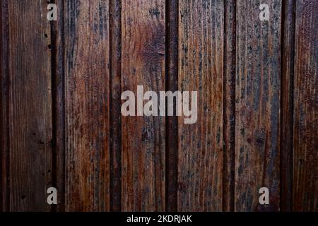 Close-up of a natural wood slat surface in dark tones useful for abstract backgrounds Stock Photo