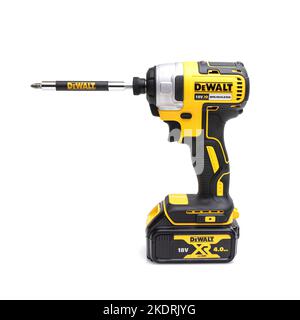 SWINDON, UK - NOVEMBER 8, 2022, DeWalt Impact driver with 18V 4AH LI-ION battery on a white background Stock Photo