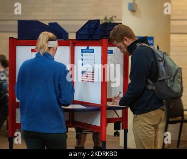 Arlington, USA. 8th Nov, 2022. Voters fill in their ballots during the U.S. midterm elections at a polling station in Arlington, Virginia, the United States, Nov. 8, 2022. Concerned voters across the United States are going to the polls to cast their ballots in the 2022 midterm elections on Tuesday amid heightened partisanship and divide. Credit: Liu Jie/Xinhua/Alamy Live News