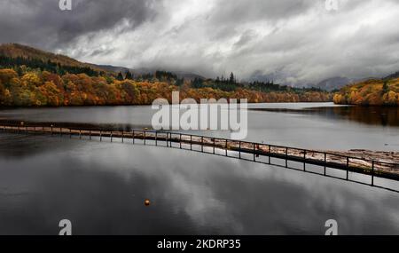 Pitlochry Perthshire Scotland Loch Faskally dark clouds over the water autumn colours in the trees Stock Photo
