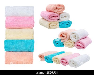 Three rolls of terry towels in pastel colors. Beautiful multi-colored kitchen towels isolated on white in different angles. Stock Photo