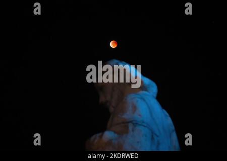 General view of Beaver Blood Moon during it's totality in Antipolo Cathedral. Beaver Blood Moon is the last total lunar eclipse for the year 2022. The next full lunar eclipse will be occurring on March 24, 2025. Total lunar eclipse happens when Earth's shadow covers the moon due to its perfect alignment between the sun and the moon, causing it to take on a reddish hue. Stock Photo
