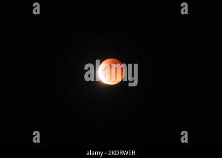 General view of Beaver Blood Moon during it's totality in Antipolo Cathedral. Beaver Blood Moon is the last total lunar eclipse for the year 2022. The next full lunar eclipse will be occurring on March 24, 2025. Total lunar eclipse happens when Earth's shadow covers the moon due to its perfect alignment between the sun and the moon, causing it to take on a reddish hue. Stock Photo