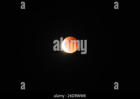 Antipolo, Philippines. 08th Nov, 2022. General view of Beaver Blood Moon during it's totality in Antipolo Cathedral. Beaver Blood Moon is the last total lunar eclipse for the year 2022. The next full lunar eclipse will be occurring on March 24, 2025. Total lunar eclipse happens when Earth's shadow covers the moon due to its perfect alignment between the sun and the moon, causing it to take on a reddish hue. (Photo by Ryan Eduard Benaid/SOPA Images/Sipa USA) Credit: Sipa USA/Ģ����ý Live News Stock Photo