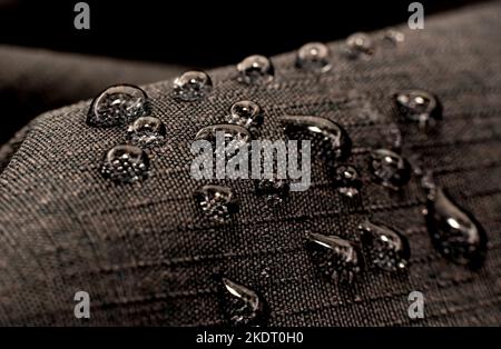 Drops of water on textiles. Waterproof fabric with drops on the surface Stock Photo
