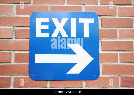 exit sign on brick wall  Stock Photo