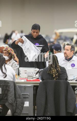Detroit, Michigan, USA. 8th Nov, 2022. City of Detroit election workers count absentee ballots early in the morning of election day. A day earlier, a judge threw out Republican Secretary of State candidate Kristina Karamo's lawsuit asking that all absentee ballots cast in Detroit be disqualified. Wayne County Chief Circuit Judge Timothy Kenny ruled that Karamo's lawsuit lacked “any shred of evidence' of election law violations. Credit: Jim West/Alamy Live News Stock Photo