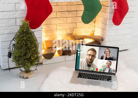 Man Working From Home Having Online Group Videoconference On Laptop Stock Photo