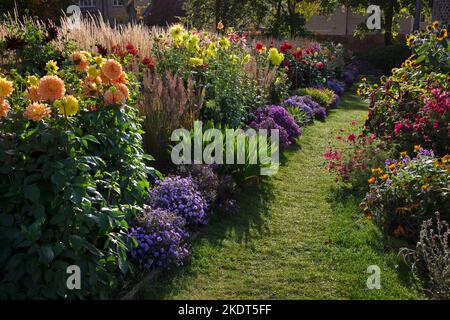 Early Autumn colourful garden boarders in english garden Stock Photo