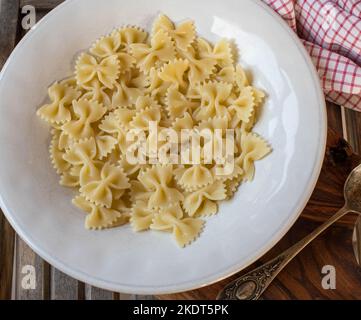 Bow tie noodles on a pasta plate Stock Photo
