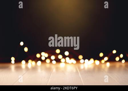 White wooden table with defocused bokeh lights. Stock Photo