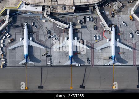 Top down view of Alaska Airlines Boeing 737 aircraft at Los Angeles International Airport Terminal 6. Aerial view of Alaska Airlines 737 airplanes. Stock Photo