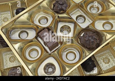 two boxes with chocolates, half-empty, close up, macro, full frame, top view Stock Photo