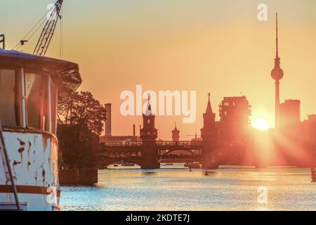 Berlin skyline during sunset with a view of the Oberbaum Bridge and the TV Tower Stock Photo