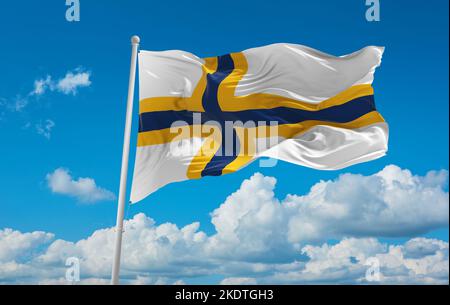 flag of Baltic Finns Sweden Finns at cloudy sky background, panoramic view. flag representing ethnic group or culture, regional authorities. copy spac Stock Photo