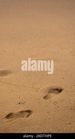 A picture of a footprints on the sand, symbolizing the memories the you leave behind in the journey of life Stock Photo