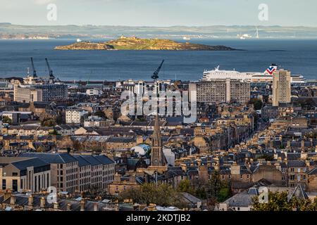 View over rooftops to Leith Walk, Inchkeith island in Firth of Forth & MS Victoria ship, Edinburgh, Scotland, UK Stock Photo