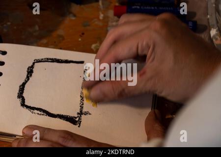 art workshop, messy objects, brushes, paint all mixed up disorganized, woman artist Stock Photo