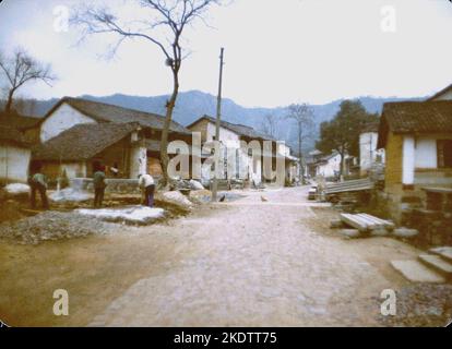 Main street of Longjing village, near Hangzhou, where the famous Longjing Green Tea is produced. December 1981 Stock Photo