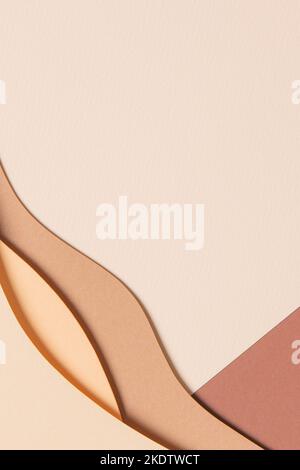 Abstract colored paper texture background. Minimal paper cut style composition with layers of geometric shapes and lines in shades of beige and brown Stock Photo