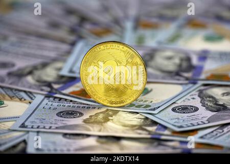 Bitcoin on US dollars banknotes. Concept of electronic decentralized money, crypto currency, global trade and economy Stock Photo