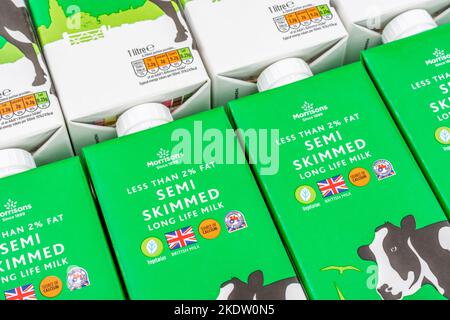 Close shot of paper cartons of Morrison's own-label long-life UHT semi-skimmed milk. For British food products, UK dairy industry, milk production UK. Stock Photo