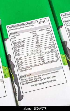 Shot of nutrition label of Morrison's own-label long-life UHT semi-skimmed milk carton. For British food produce, UK dairy industry & milk production. Stock Photo