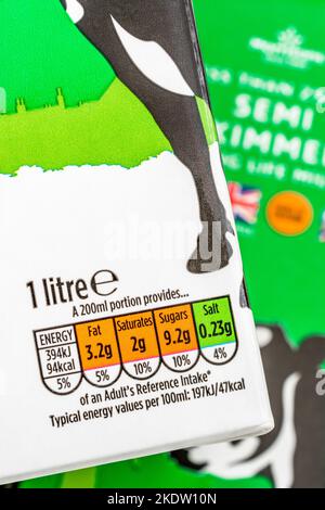 Close shot of food traffic lights nutrition label of Morrison's own-label long-life UHT semi-skimmed milk carton. For healthy British food produce,. Stock Photo