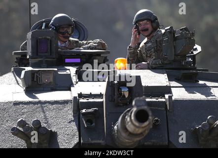 File photo dated 24/09/2018 of the then Defence Secretary Gavin Williamson (left) taking a ride in a Challenger 2 tank in Bovington, Dorset. He has resigned, saying the allegations against him were 'becoming a distraction for the good work this government is doing'. Issue date: Tuesday November 8, 2022. Stock Photo