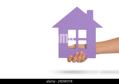 House in hand, isolation. Violet model of a house in the hands of a child isolated on a white background. Homeless housing, family home, home Stock Photo