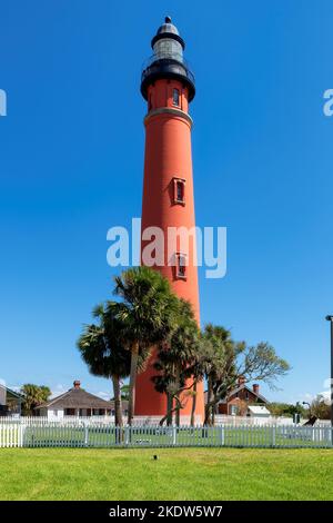 Ponce de Leon Inlet Lighthouse and palm trees around in Daytona Beach, Florida. Stock Photo