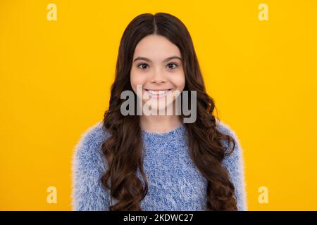 Happy teenager, positive and smiling emotions of teen girl. Child little girl 12, 13, 14 years old background studio portrait. Close-up portrait Stock Photo