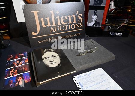 A pair of photo-matched round wire-rimmed gold-tone glasses owned and worn by John Lennon on display in Hard Rock Cafe Times Square on November 08, 20 Stock Photo