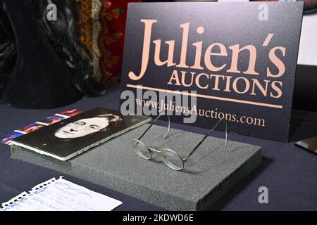 A pair of photo-matched round wire-rimmed gold-tone glasses owned and worn by John Lennon on display in Hard Rock Cafe Times Square on November 08, 20 Stock Photo