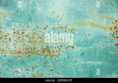 Old weathered rusty tin metal sheet surface closeup as grunge green background Stock Photo