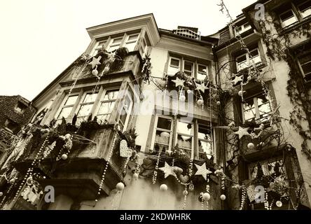 STRASBOURG, FRANCE - DECEMBER 21, 2015: Christmas decoration with white bears, red hearts and snowflakes in medieval city of Strasbourg. Sepia photo Stock Photo